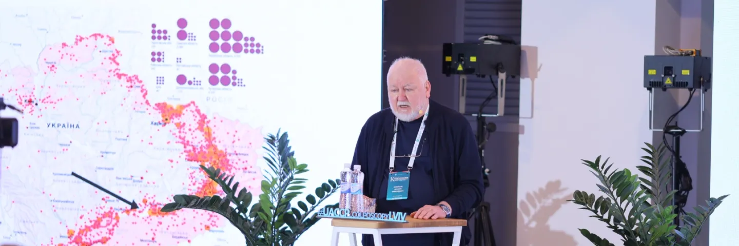 Older man speaking at a podium