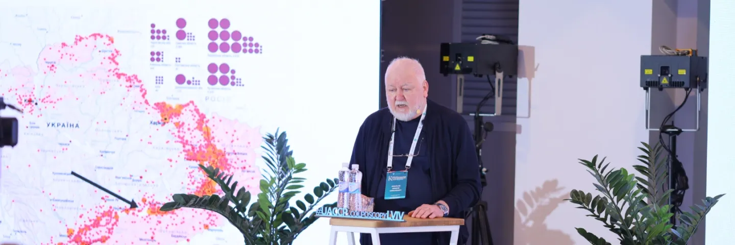 Older man speaking at a podium