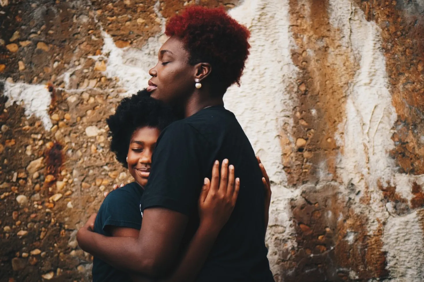 Women's cancer: two black women hugging each other