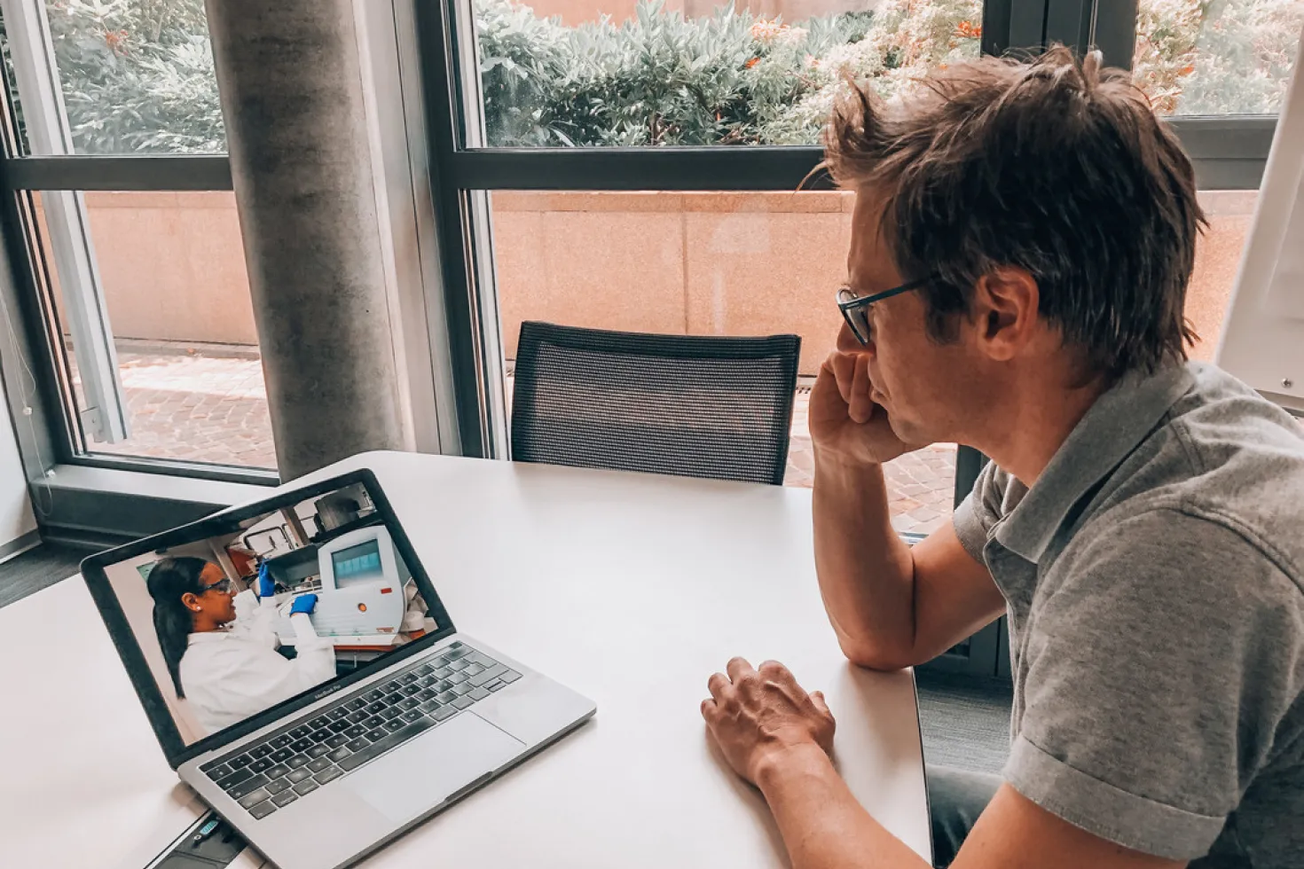 Man looking at video on his computer