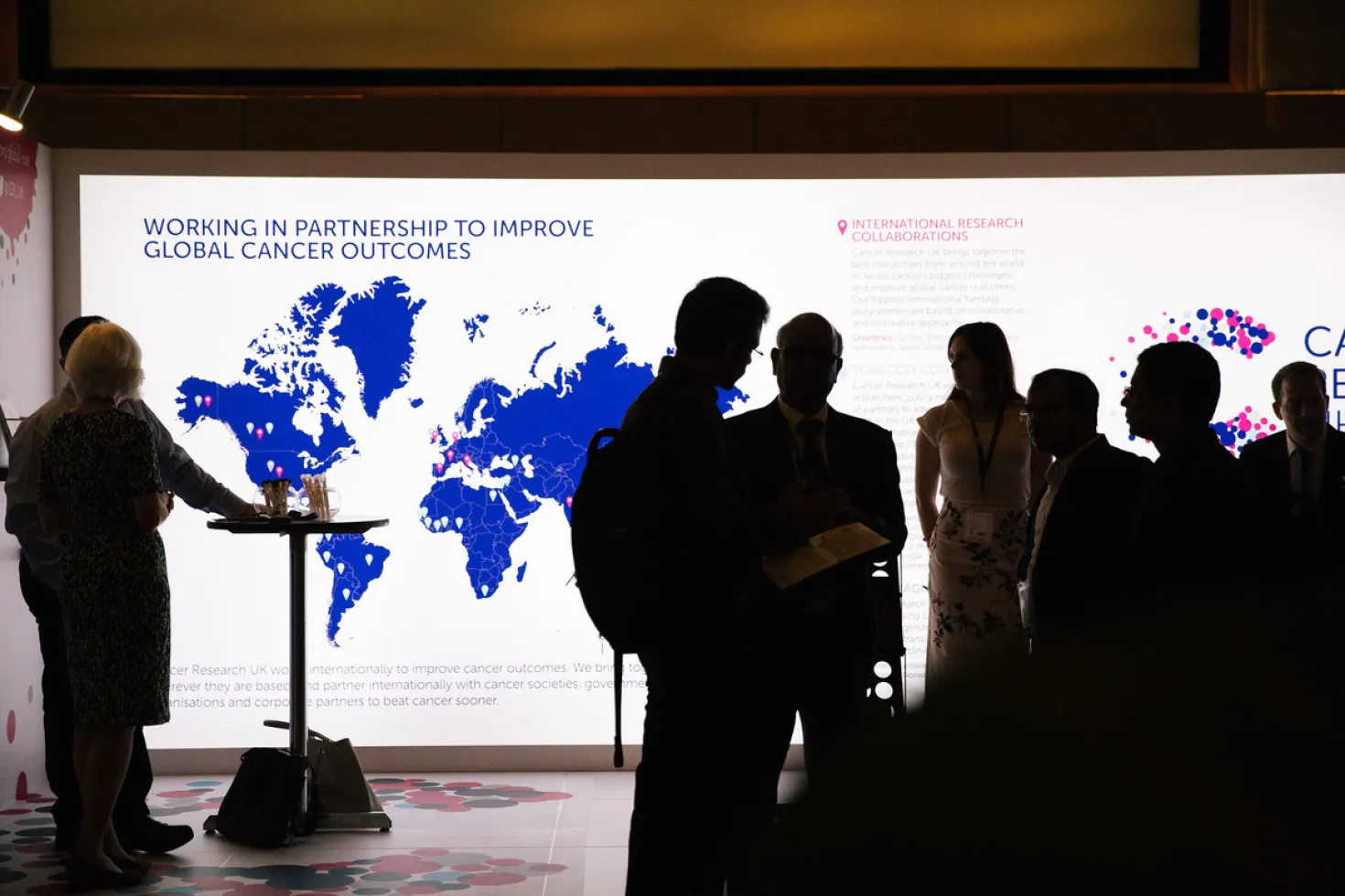 People chatting at the 2018 World Cancer Congress