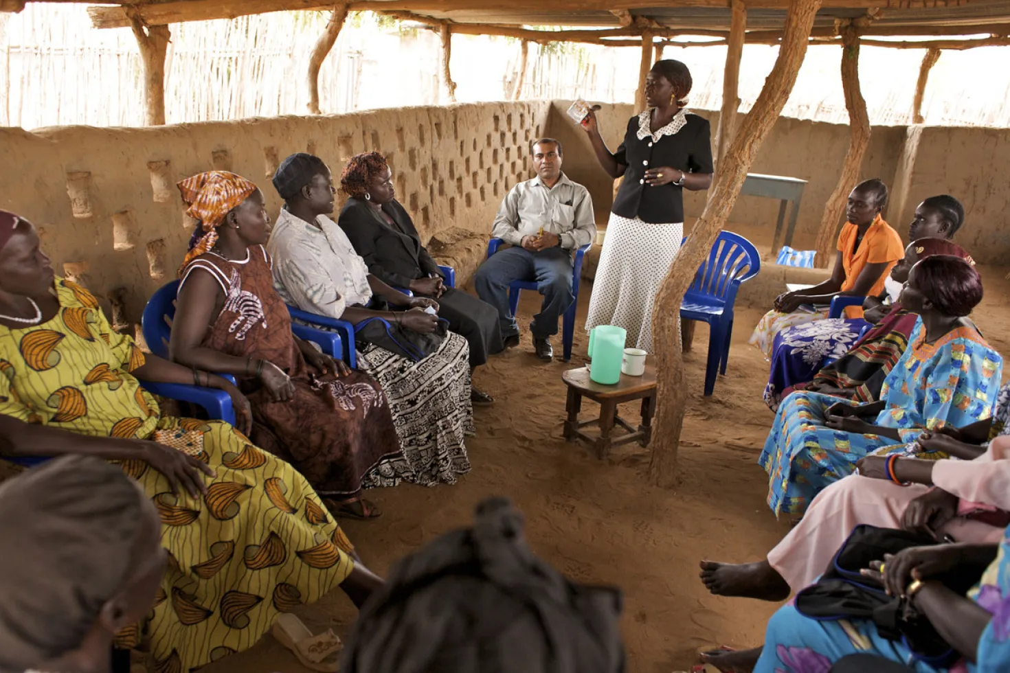 A Community Health Organizer (CHO) shows a group of women how to prepare Oral Rehabilitation Saline (ORS), during a refresher’s course for Community Health Volunteers (CHV), in Juba, the capital of South Sudan. 