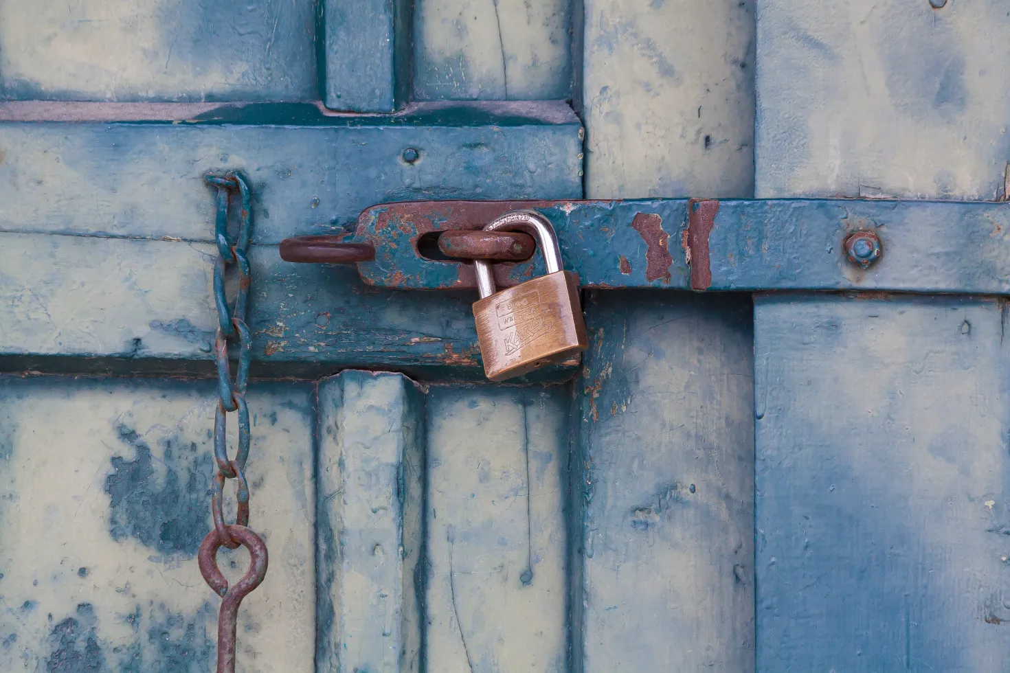 Padlock on a blue door