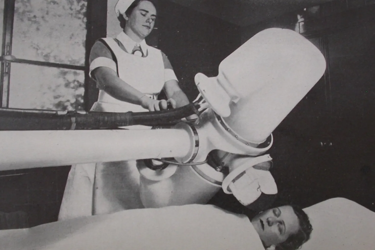 Clinician conducting a mammography in 1948