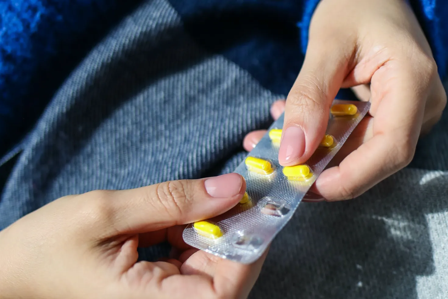 woman taking antibiotics