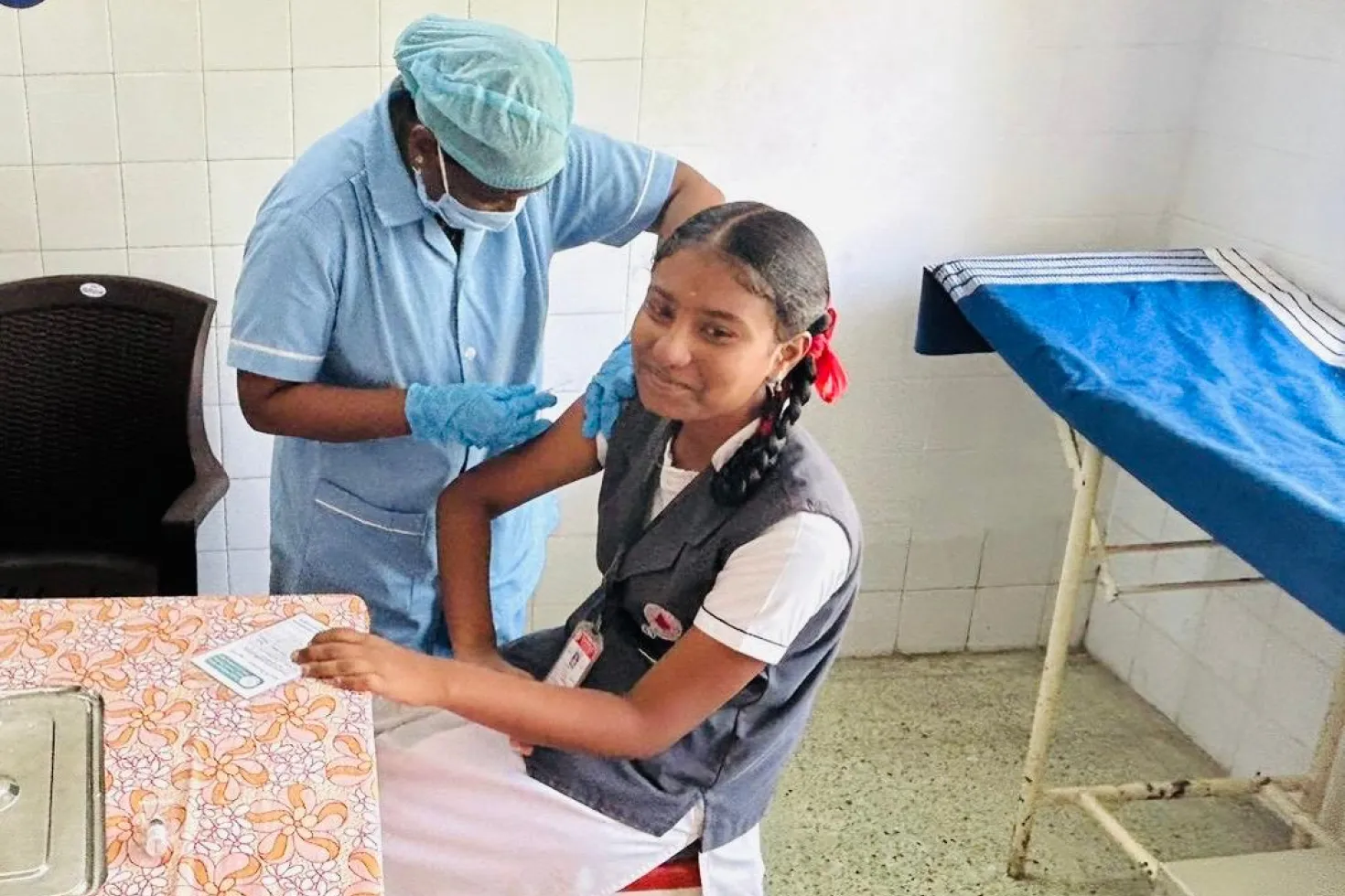 Young girl in India getting an HPV vaccination shot