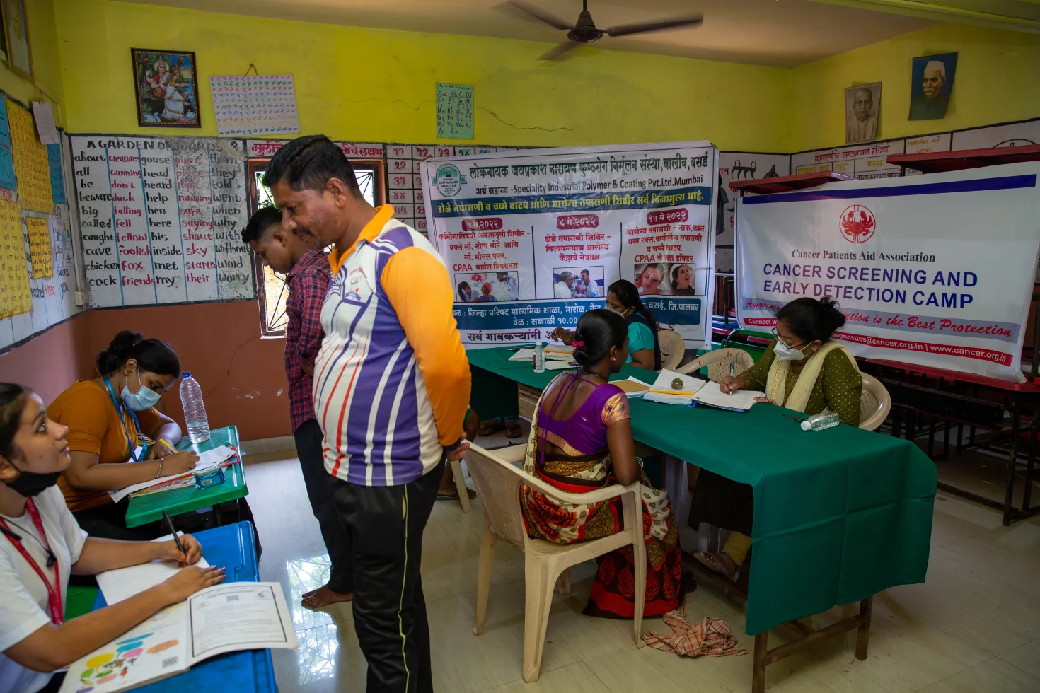 People visiting a cancer screening and early detection camp organised by the Cancer Patients Aid Association in India