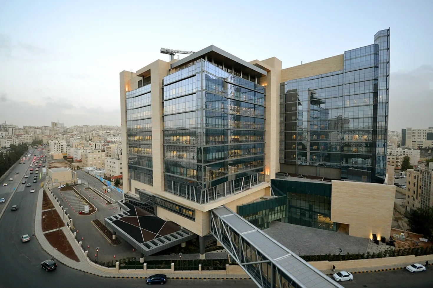 Glass faced building, about 10 stories high