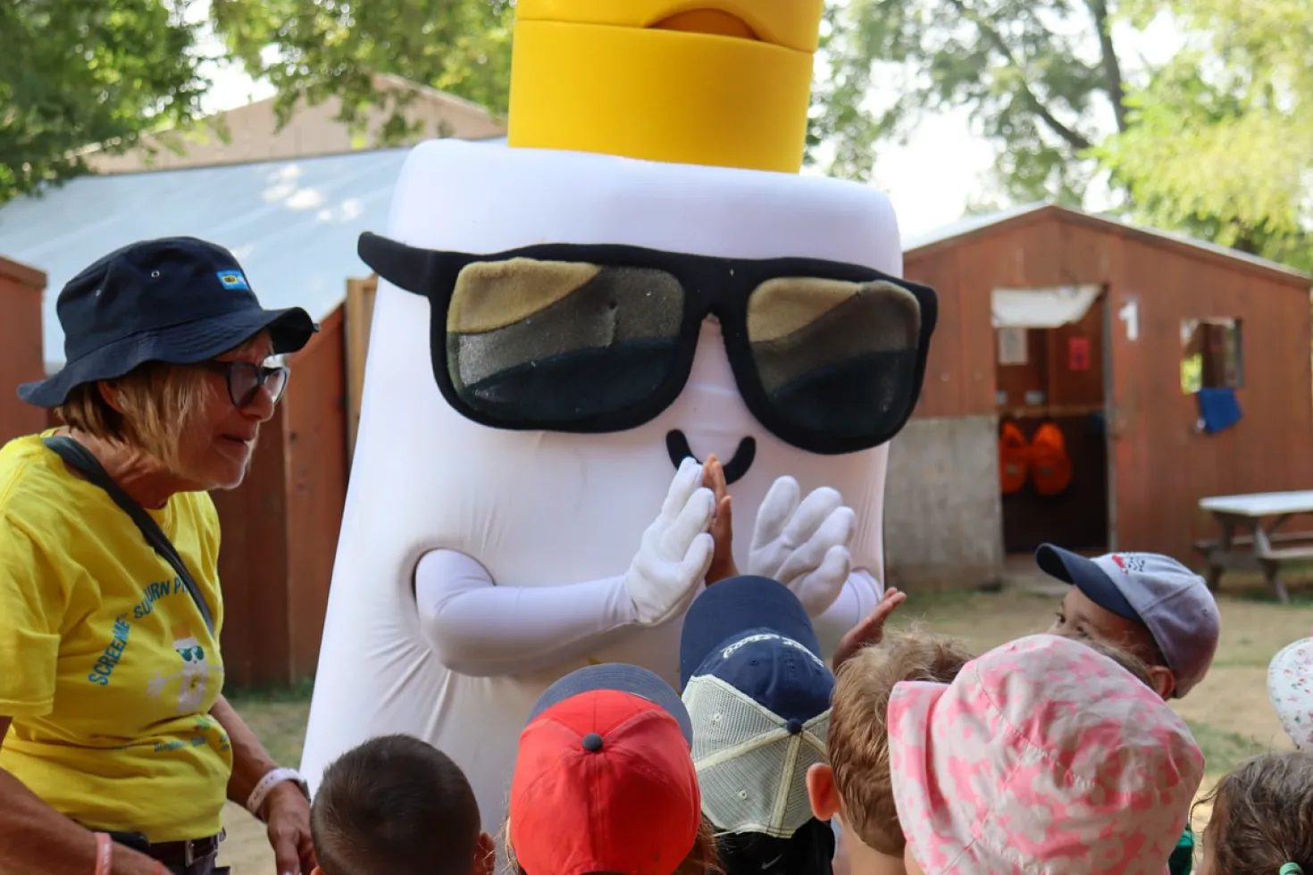 Melanoma Canada mascot in shape of sunscreen bottle