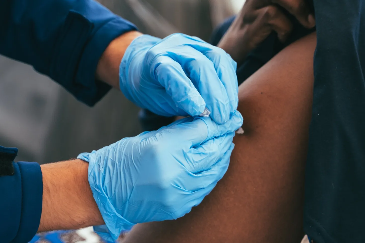 Women receiving a vaccine shot
