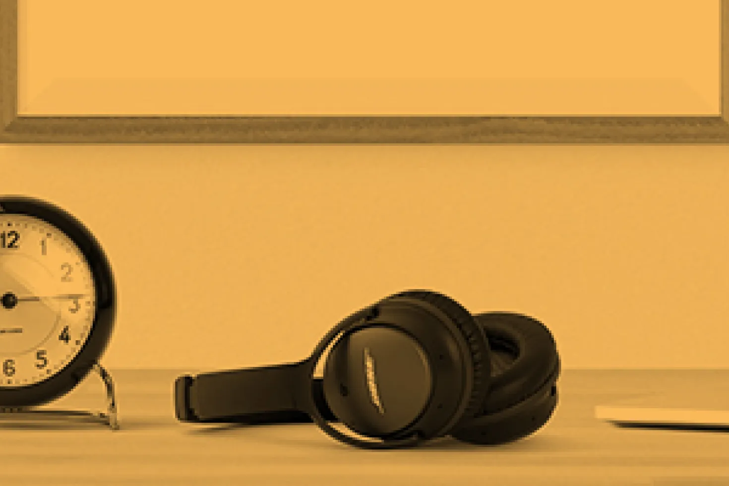 Virtual offer header with headphones and computer on desk