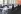 Diverse group of people sitting around a conference table, in the background branded UICC poster