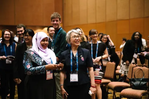 2 women smiling in the public