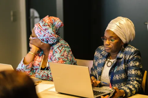 black woman typing on her laptop