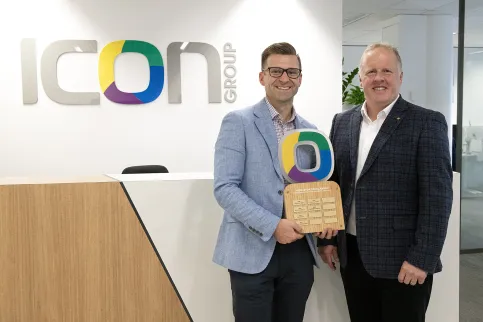 Matthew Rundle (left) receiving the Middleton Scholarship trophy from Icon Group CEO Mark Middleton