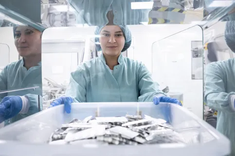 Pharmacist taking box of pills 
