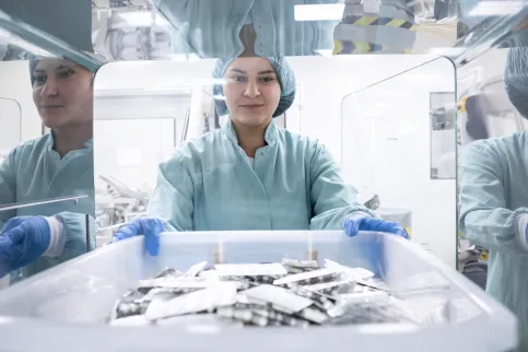 Pharmacist taking box of pills 