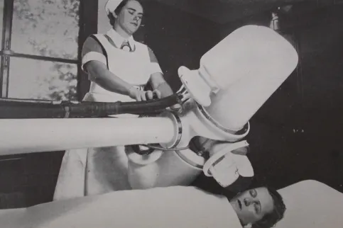 Clinician conducting a mammography in 1948