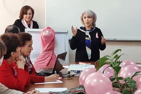 Staff member of Avesto in Tajikistan advocating for better breast cancer control