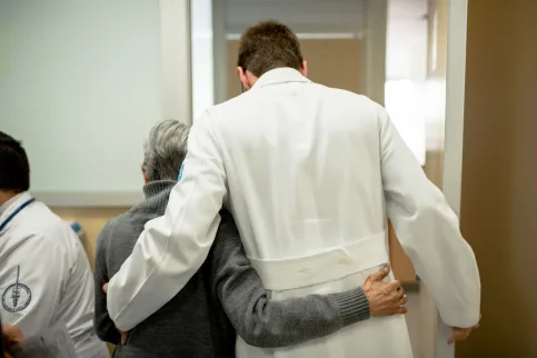 Enrique Soto with a patient 