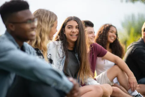 A diverse group of university students gathered, laughing