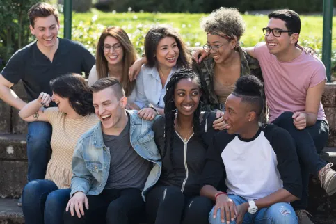 Group photo of a diverse body of students laughing