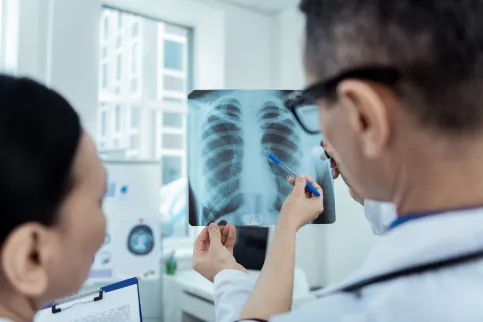 Close up of radio scan in hands of professional doctors detecting problems
