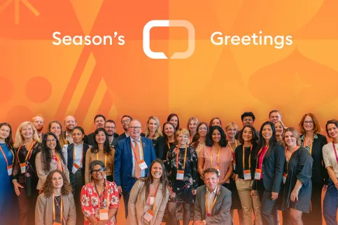 Season's greetings card from UICC, with staff photo against branded orange background