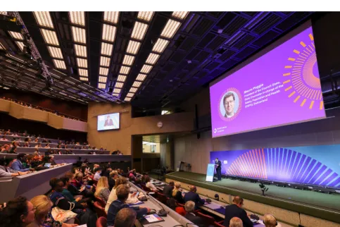 cover of the International Journal of Cancer featuring people sitting in an auditorium at the World Cancer Congress