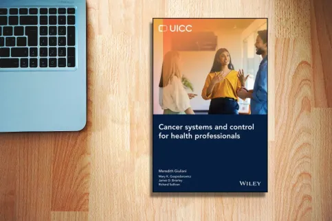 Cancer Systems book cover on a desk