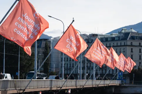 Row of branded World Cancer Day flags on a bridge in Geneva, Switzerland