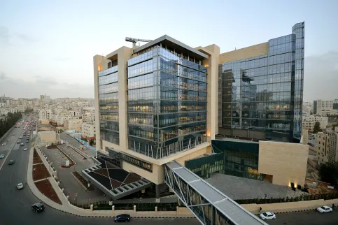 Glass faced building, about 10 stories high