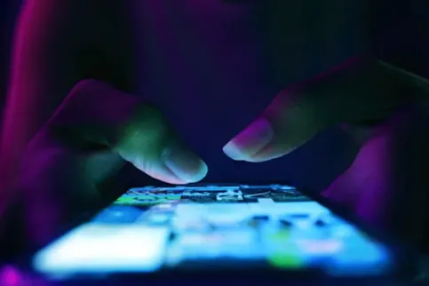 thumbs on phone screen
