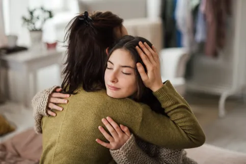 Two women hugging
