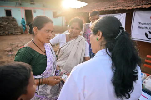 Female doctor is explaining the appropriate medication dosage to a woman