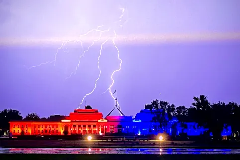 The old Parliament House in Canberra, Australia, lit up in orange for World Cancer Day thanks to ICON Group