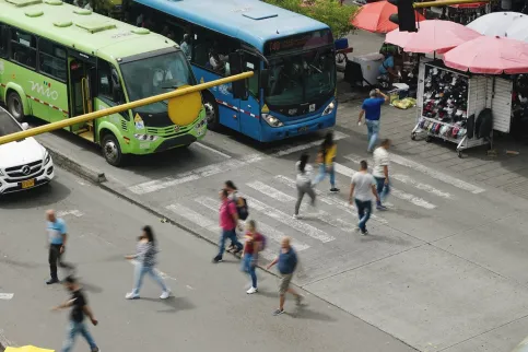 People crossing busy street in Latin American city