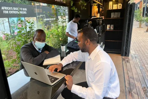 UICC alumni Young Leaders, Dr Kingsley I. Ndoh, Founder and Chief Strategist of Hurone AI, and Dr Francois Uwinkindi, Non-Communicable Diseases Division Manager at Rwanda Biomedical Center, which is helping deploy a test version of the health app Guzika in Rwanda.