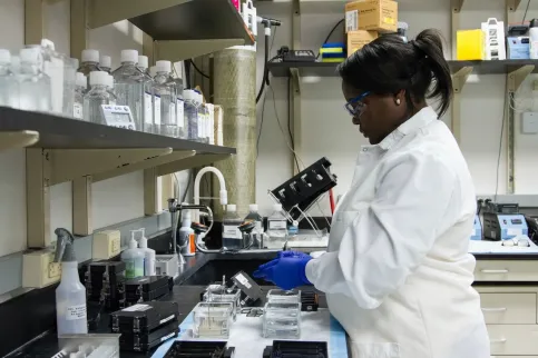 Women conducting tests in a lab.
