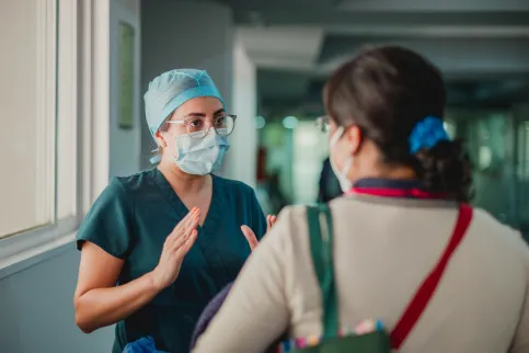 Doctor speaking to a patient in a clinic in Mexico