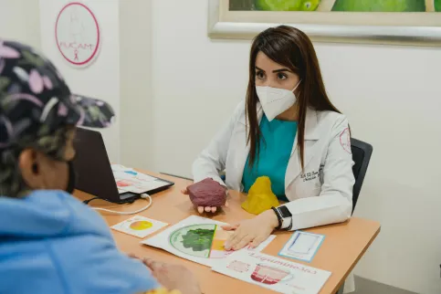 Doctor advising a breast cancere patient on medicine.