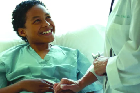 Young smiling patient being treated by a doctor