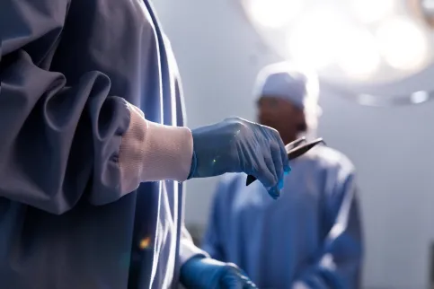 Doctor holding tweezers