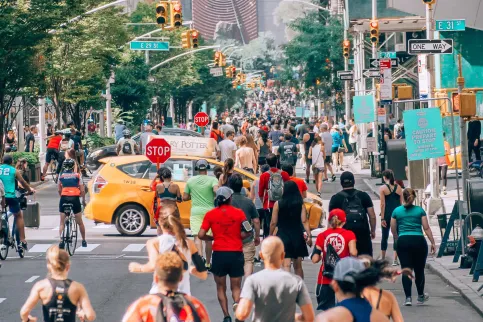 A bustling street of New York with joggers everywhere