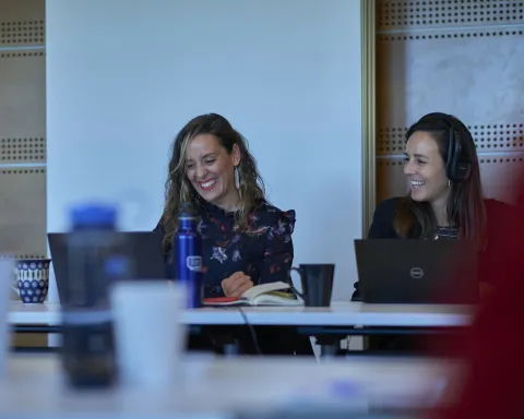 UICC Staff members exchange smiles as they watch the virtual World Cancer Leaders' Summit 2021