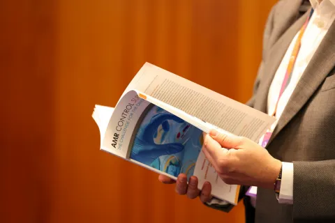 hands holding an AMR publication