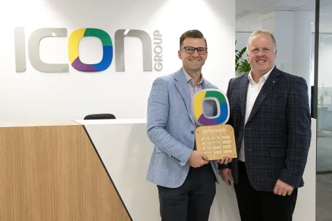 Matthew Rundle (left) receiving the Middleton Scholarship trophy from Icon Group CEO Mark Middleton