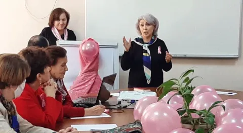 Staff member of Avesto in Tajikistan advocating for better breast cancer control