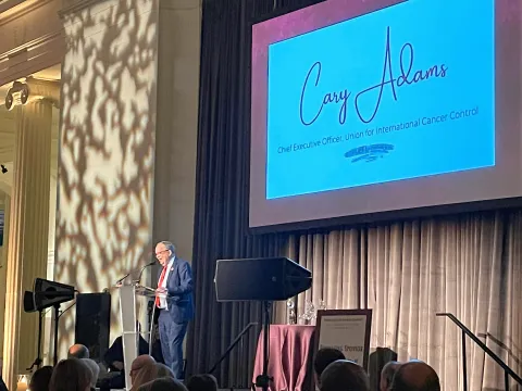 Cary Adams accepts award in 2023
