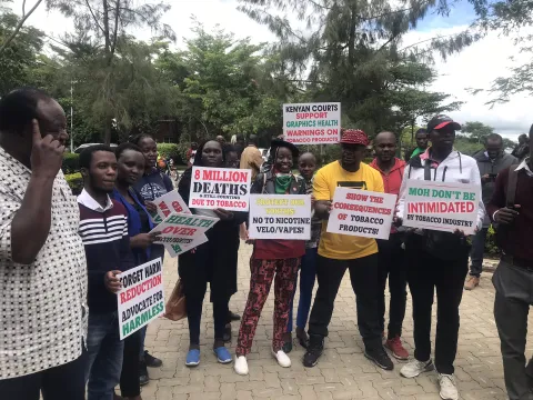 Youth tobacco control activists from the Kenyan tobacco control alliance (KETCA) protesting against tobacco industry interference with posters and banners.